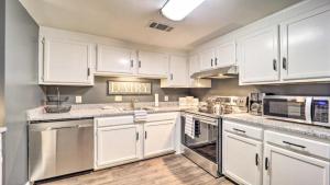 a kitchen with white cabinets and stainless steel appliances at 3 Mi to Skiing Mtn-View Condo in Sugar Top Resort in Sugar Mountain