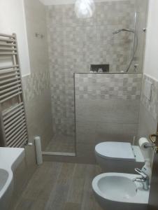 a bathroom with a shower and a toilet and a sink at Mare Incanto in Gragnano
