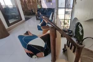 a group of blue chairs in a room at Liane's Place Puerto Princesa in Puerto Princesa City