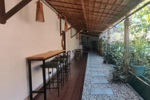 a patio with a table and chairs in a building at Liane's Place Puerto Princesa in Puerto Princesa City