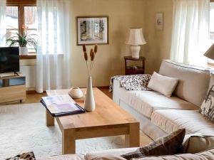 a living room with a vase on a coffee table at 4 star holiday home in ELDSBERGA in Eldsberga