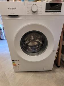 a white washing machine in a store at Villa il Gabbiano Stintino in Stintino