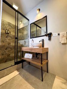 a bathroom with a sink and a shower at Hotel Ferre Cusco in Cusco