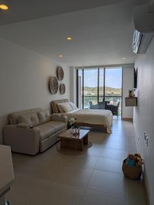 a living room with a couch and a bed and a table at Manzanillo Loft Morros EOS in Cartagena de Indias +85 photos