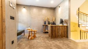 a living room with a couch and a table at Moon Alaçatı adults only in Çeşme +26 photos