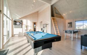 a pool table in a room with a staircase at Nice Home In Ringkøbing With Sauna in Ringkøbing +21 photos