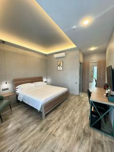 a bedroom with a bed and a desk and a computer at Yerevan Street hotel in Yerevan +76 photos