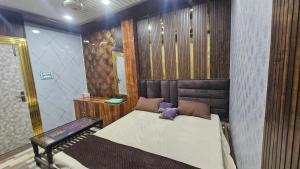 a bedroom with a bed in a room at Yatri room in Varanasi