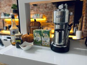 a kitchen counter with a coffee maker and some food at Agro Bieszczady Sleep Tourism in Czarna