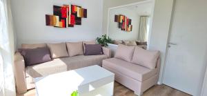 a living room with a couch and a table at Departamento PH en Martinez in Martínez