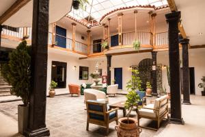 a large living room with a glass ceiling at Hotel Ferre Cusco in Cusco