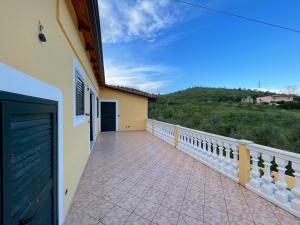 a balcony of a house with a fence and a gate at Solemar4 in Vlorë