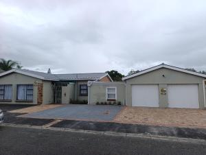 a house with two white garage at Siyapeya Household in Bellville