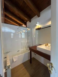 a bathroom with a tub and a sink and a mirror at HOTEL RURAL Casa Campo in Abay +68 photos