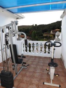 a gym on the roof of a house at Hotel Solar de Maria in Ouro Preto