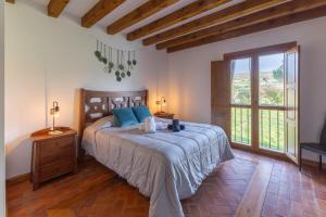 a bedroom with a bed and a large window at Punta Me Mansion De Gallegos in Gallegos +35 photos