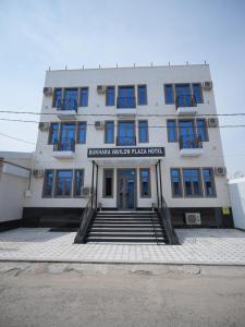 a building with blue windows and stairs in front of it at Bukhara Vavilon Plaza Hotel in Bukhara