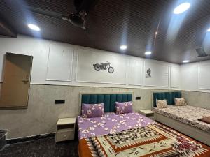 a room with a bed in a room with white cabinets at Hotel yes in Jaipur