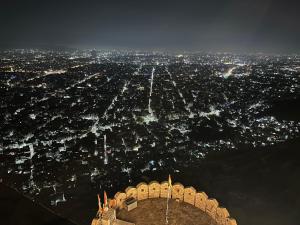 an aerial view of a city at night at Hotel yes in Jaipur