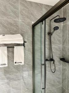 a shower with a glass door in a bathroom at Jardin d'orient in Dakar +27 photos