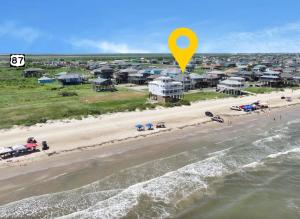an aerial view of a beach with a yellow marker at Blue Anchor home in Crystal Beach