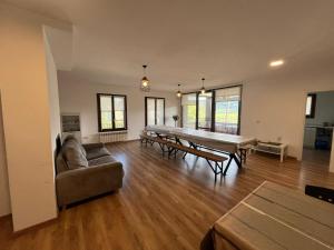 a living room with a ping pong table and a couch at HOTEL RURAL Casa Campo in Abay