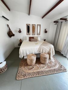 a bedroom with a bed with two baskets on it at Francisco Jonas de Oliveira in Itapipoca