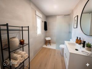 a bathroom with a sink and a toilet and a mirror at Dulces Sueños Amistad in Valencia