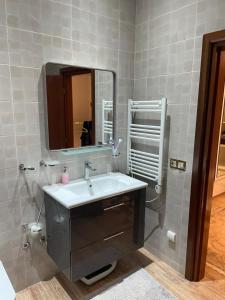 a bathroom with a sink and a mirror at Dar Ghita in Arrouaïs +11 photos