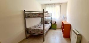 a bedroom with two bunk beds in a room at Can Tete in Malgrat de Mar +32 photos