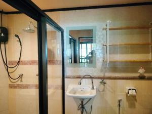 a bathroom with a sink and a mirror at Suntisook Resort in Ko Yao Noi +86 photos