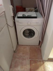 a washer and dryer in a small room at Studio Panagiota in Kavála