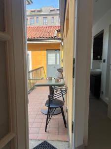 a view of a balcony with a table and chairs at The Orso Suite -Brera in Milan