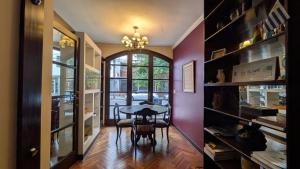 a dining room with a table and some shelves at Delvino Boutique Hotel in Salta