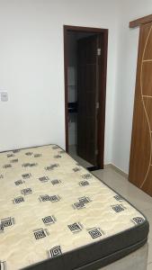 a bed sitting in a room with a mattress at Temporadaemjaua in Camaçari +7 photos