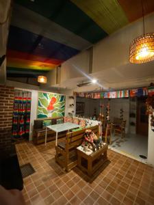 a living room with a couch and a table at MATARA GREENS HOTEL in Cusco