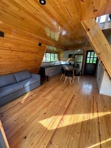 a large living room with a couch and a table at Villa Alpina in Oxapampa