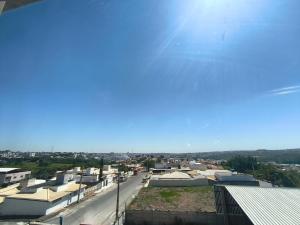 a view of a city from the roof of a building at APART HOTEL Lar Doce Lar 2 & 7 in Arcos