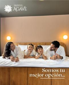 a group of people laying on a bed at Hotel Casa Agave in Baños