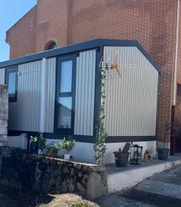 a building with a window and a cactus at El Descanso de Eros in Villarino de los Aires