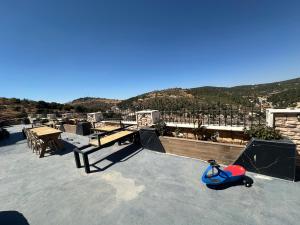 a small scooter sitting on top of a roof at Umm Aljulud Cottages 01 in Ajloun
