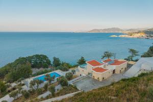 an aerial view of a house by the water at Kokkari Villa in Kokkari