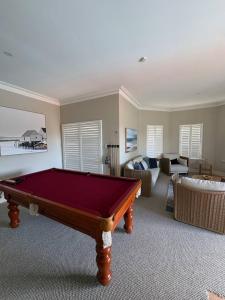 a living room with a pool table in it at Wonnerup Beach Manor in Wonnerup