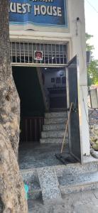 an entrance to a guest house with stairs in front at Madhav guest house in Agra