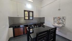 a bathroom with a counter with a sink and a sink at Winter Bloom Homestay Munnar in Munnar