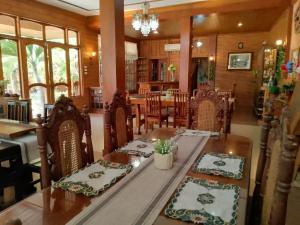 a dining room with a table and chairs at REKWOOD Hotel in Boracay