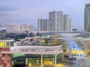 a large building in a city with tall buildings at SPICE Skyview Luxe Tunas 3B2B in Relau