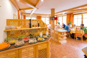 a kitchen with plates of food on a counter at Gasthof-Pension Waldfriede in Liesing