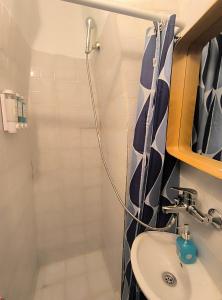 a bathroom with a sink and a shower at Villa fisfiri 1 in Serifos Chora +43 photos