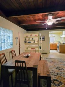 a dining room with a table and a ceiling fan at Ocean view-Huge backyard-Quiet neighborhood in Bodega Bay